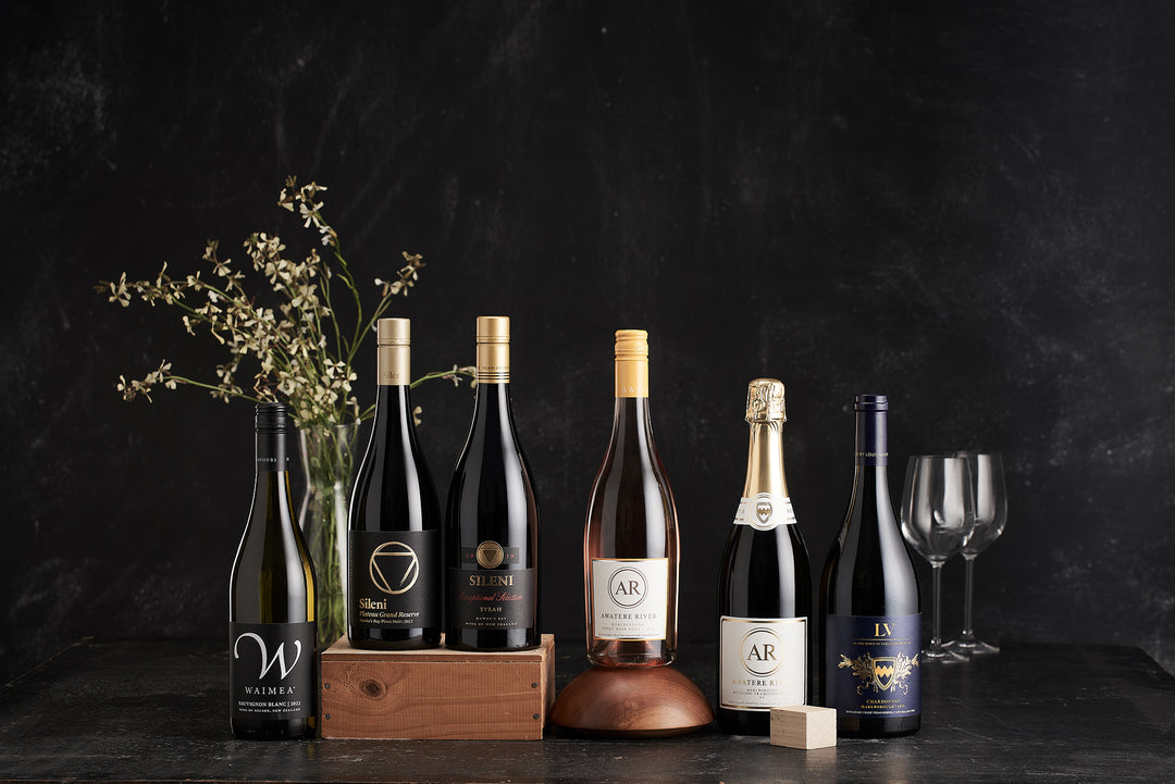 Collection of wine bottles on a dark background